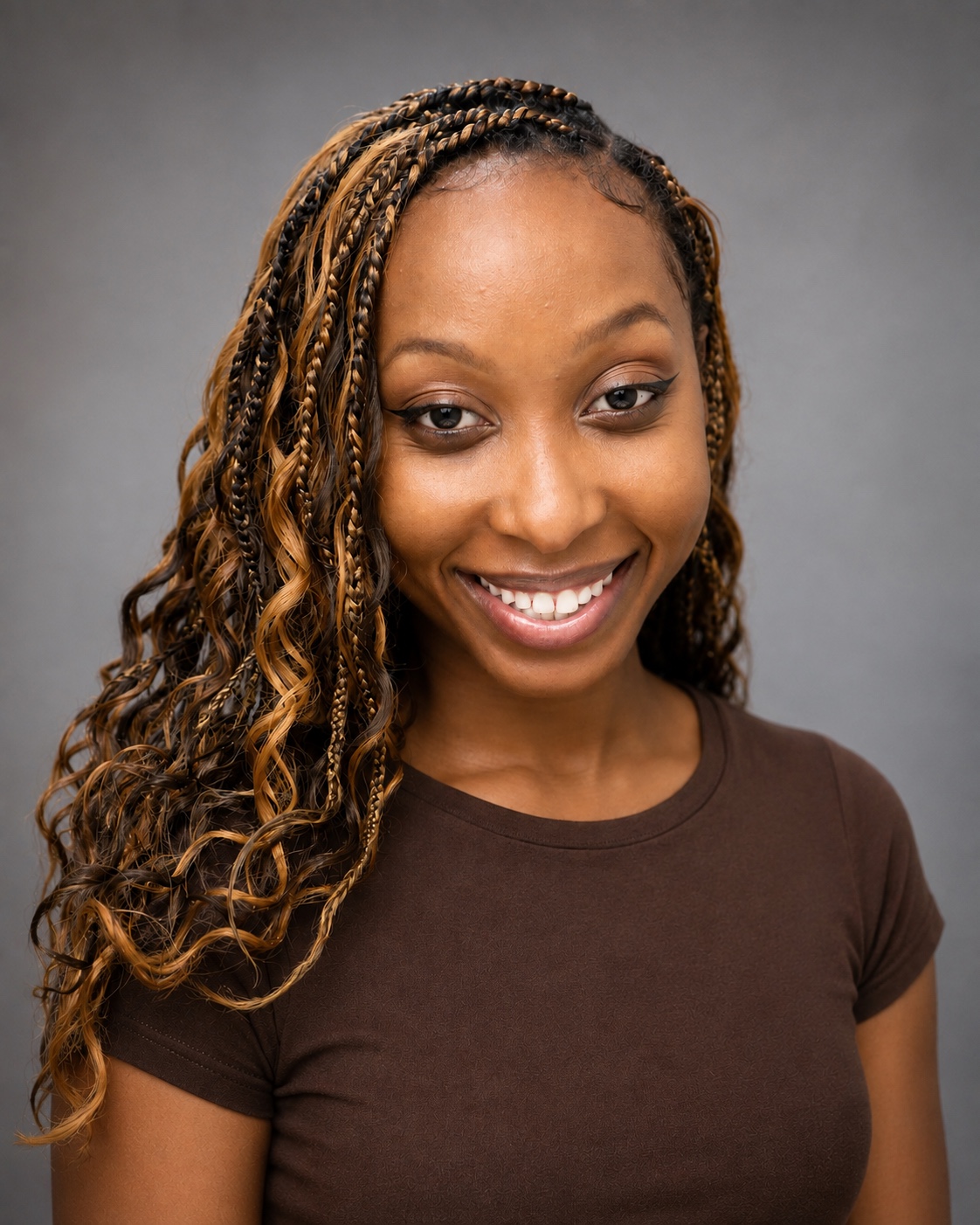 Yasmeen Hull smiling in a natural casting headshot